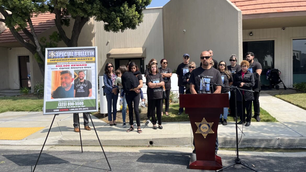 Family members and law enforcement officials at a press conference announcing a reward for information about Carlos Alvarez-Diaz's murder