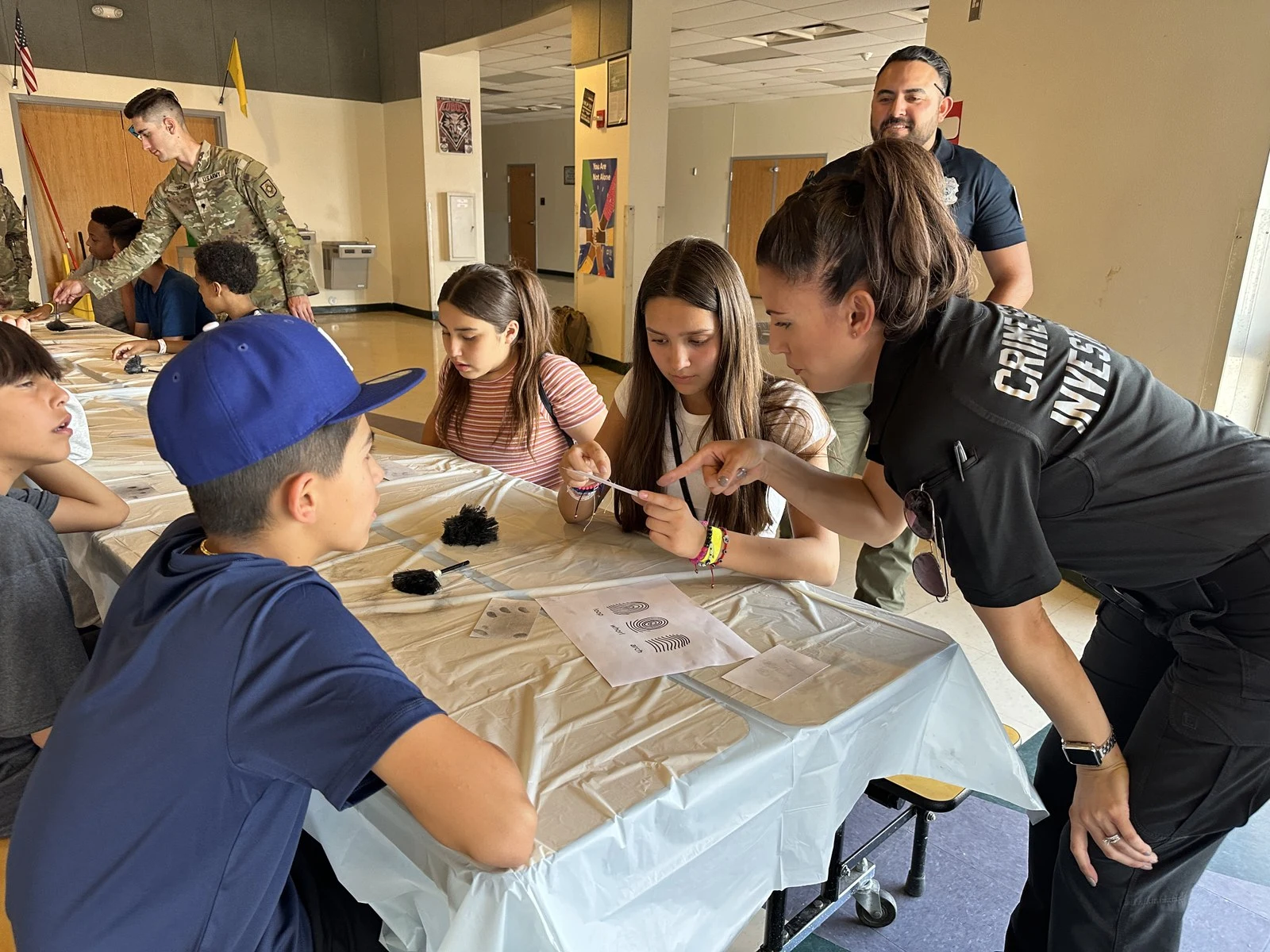 Albuquerque Police Department officers engage with youth participants during Camp Fearless