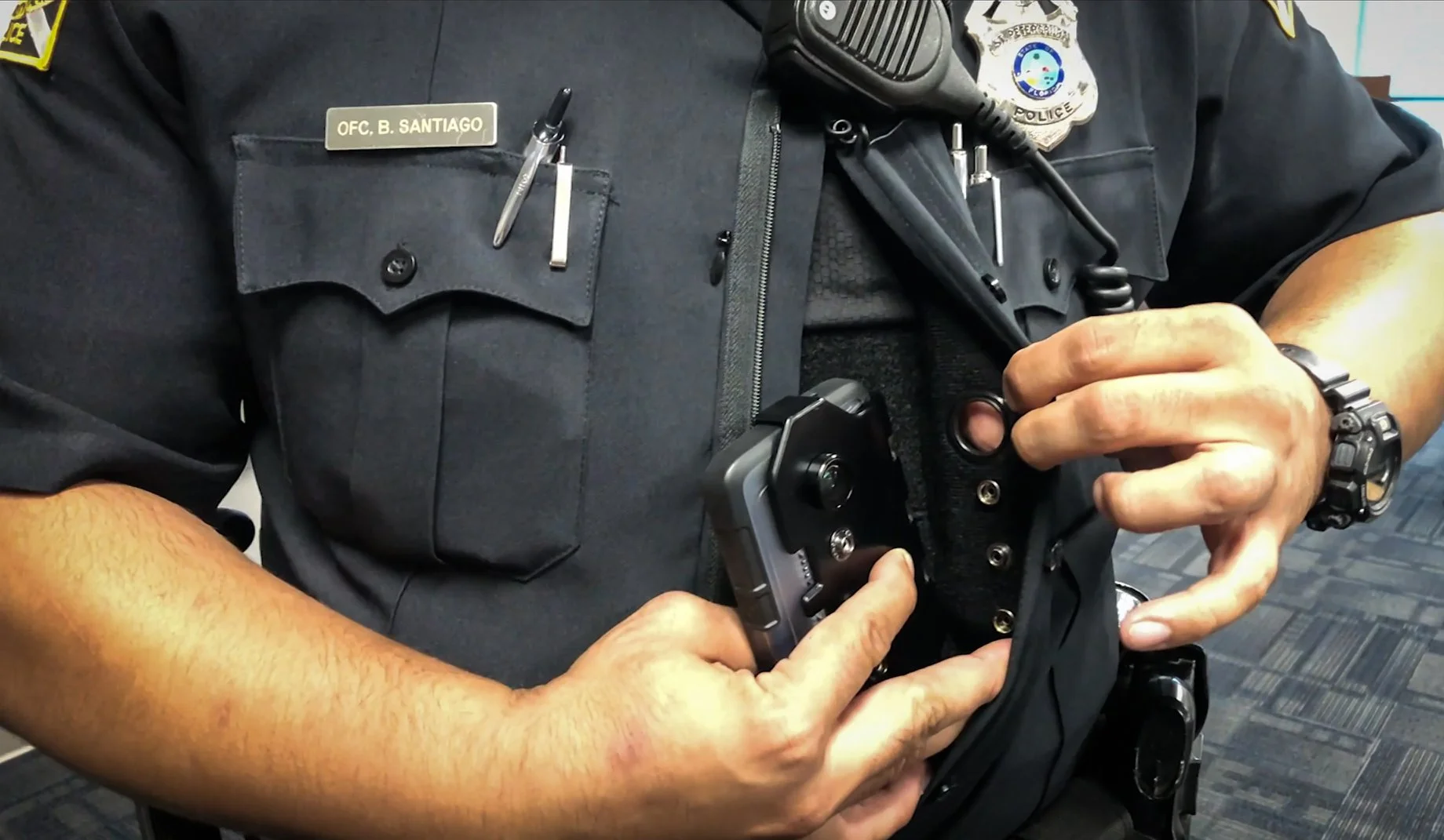 St. Petersburg Police Officer B. Santiago demonstrates new body camera technology