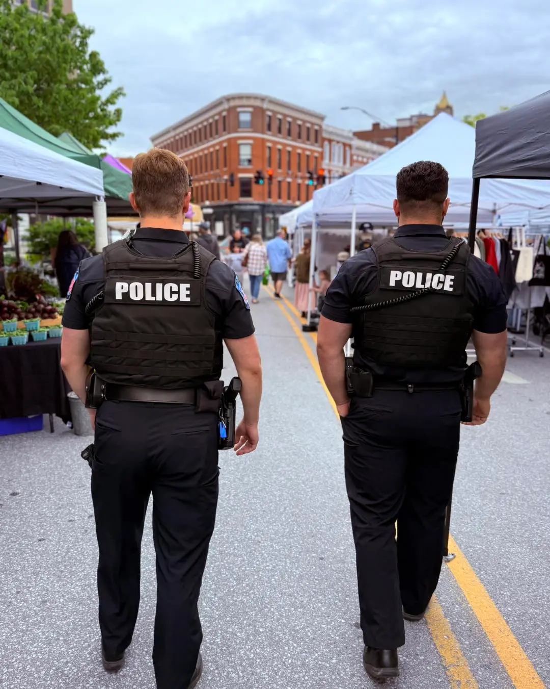 Rutland City Police officers walk the beat at the local farmers market